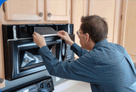 repair of wall mounted microwave oven in client's kitchen